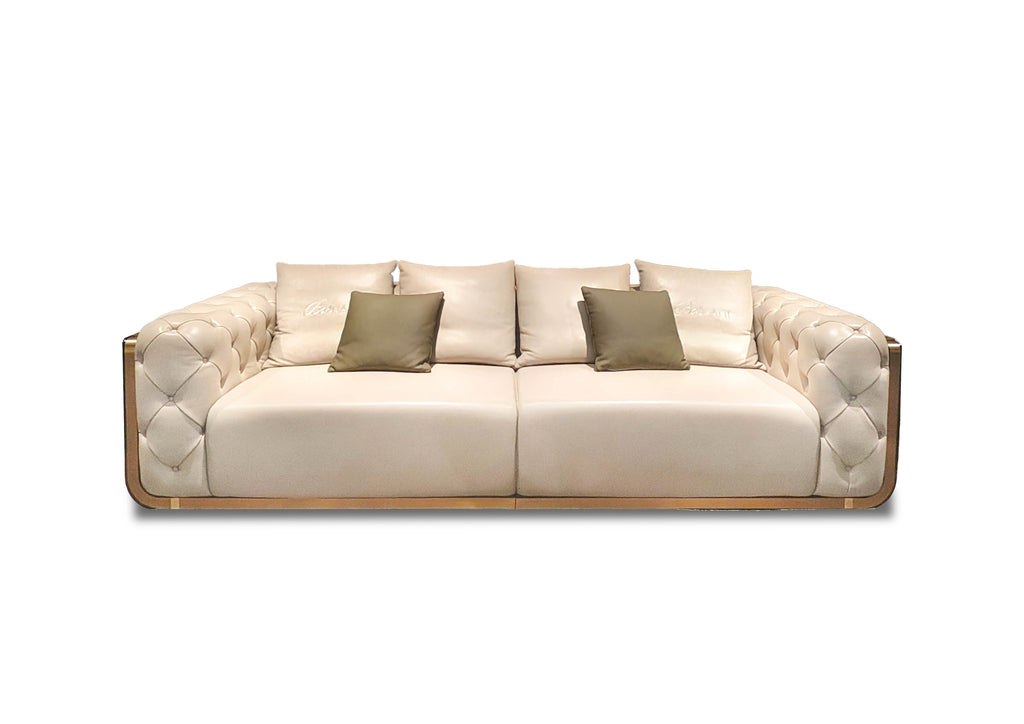Luxury Cream Leather Sofa with Gold Accents and Decorative Pillows