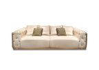 Luxury Cream Leather Sofa with Gold Accents and Decorative Pillows
