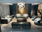 Luxury Cream Leather Sofa with Gold Accents and Decorative Pillows
