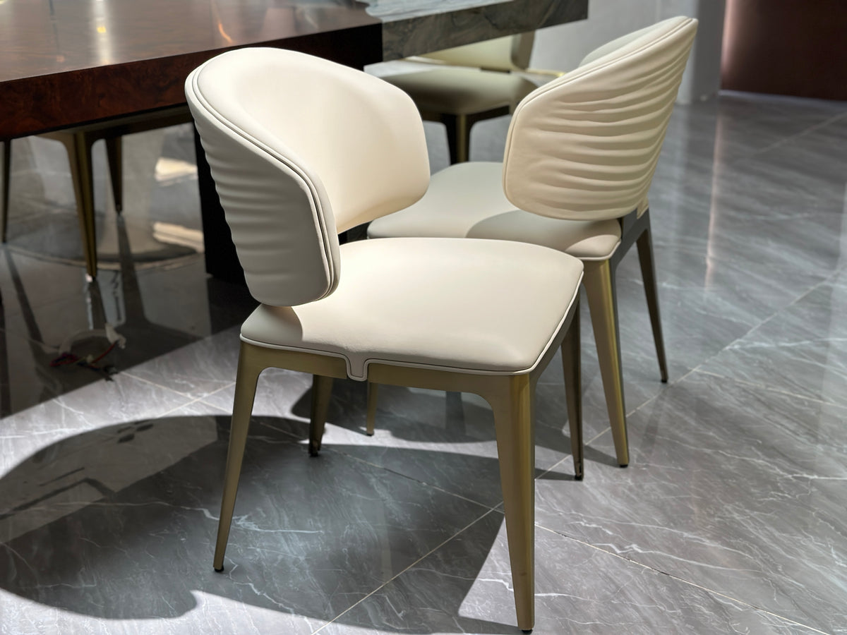 Elegant Beige Leather Chair with Metallic Frame