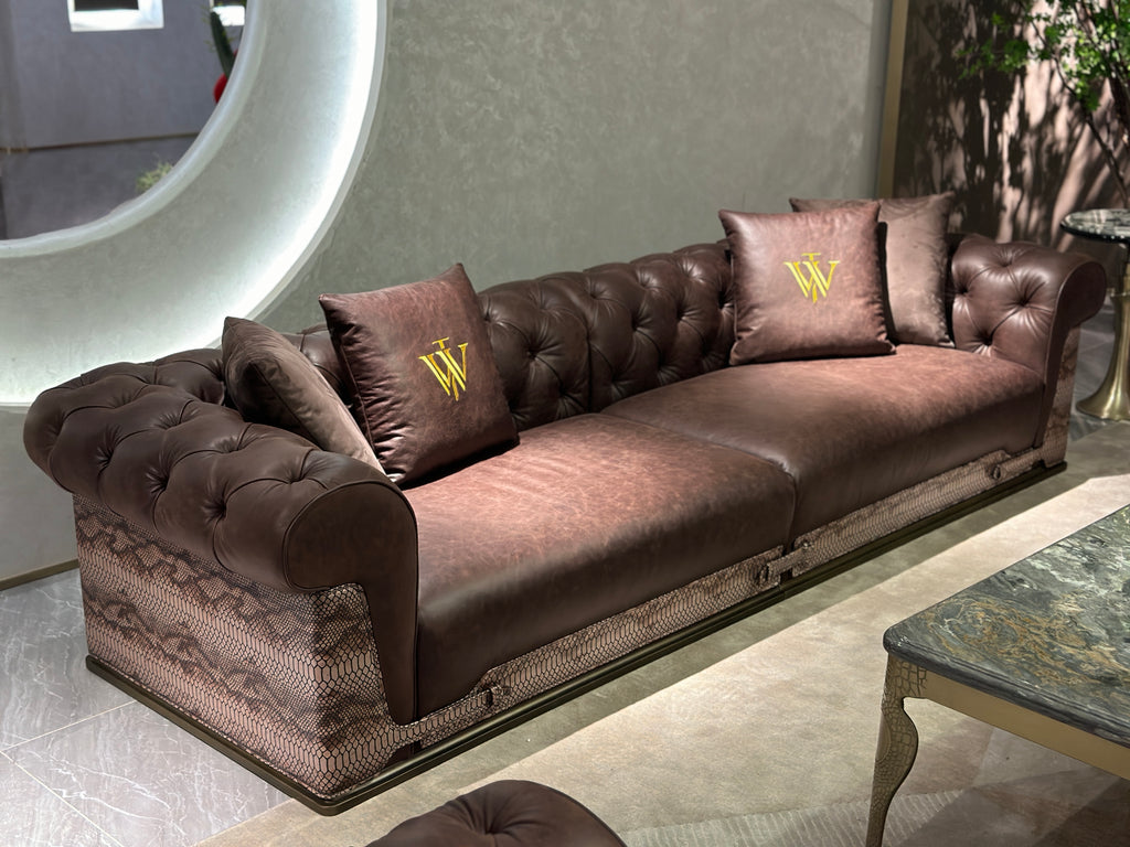 Luxury Tufted Sofa with Embroidered Pillows and Patterned Accents
