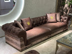 Luxury Tufted Sofa with Embroidered Pillows and Patterned Accents