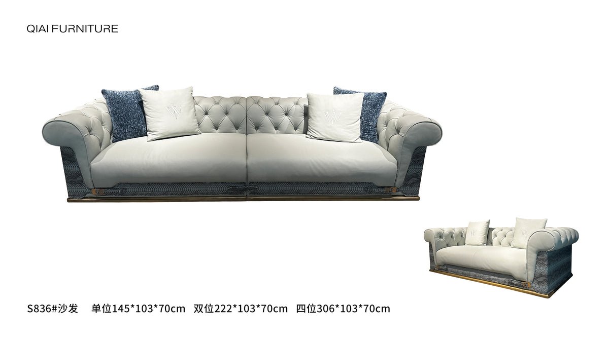 Luxury Tufted Sofa with Embroidered Pillows and Patterned Accents