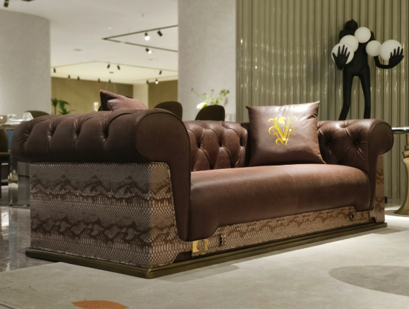 Luxury Tufted Sofa with Embroidered Pillows and Patterned Accents