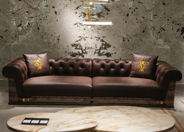 Luxury Tufted Sofa with Embroidered Pillows and Patterned Accents