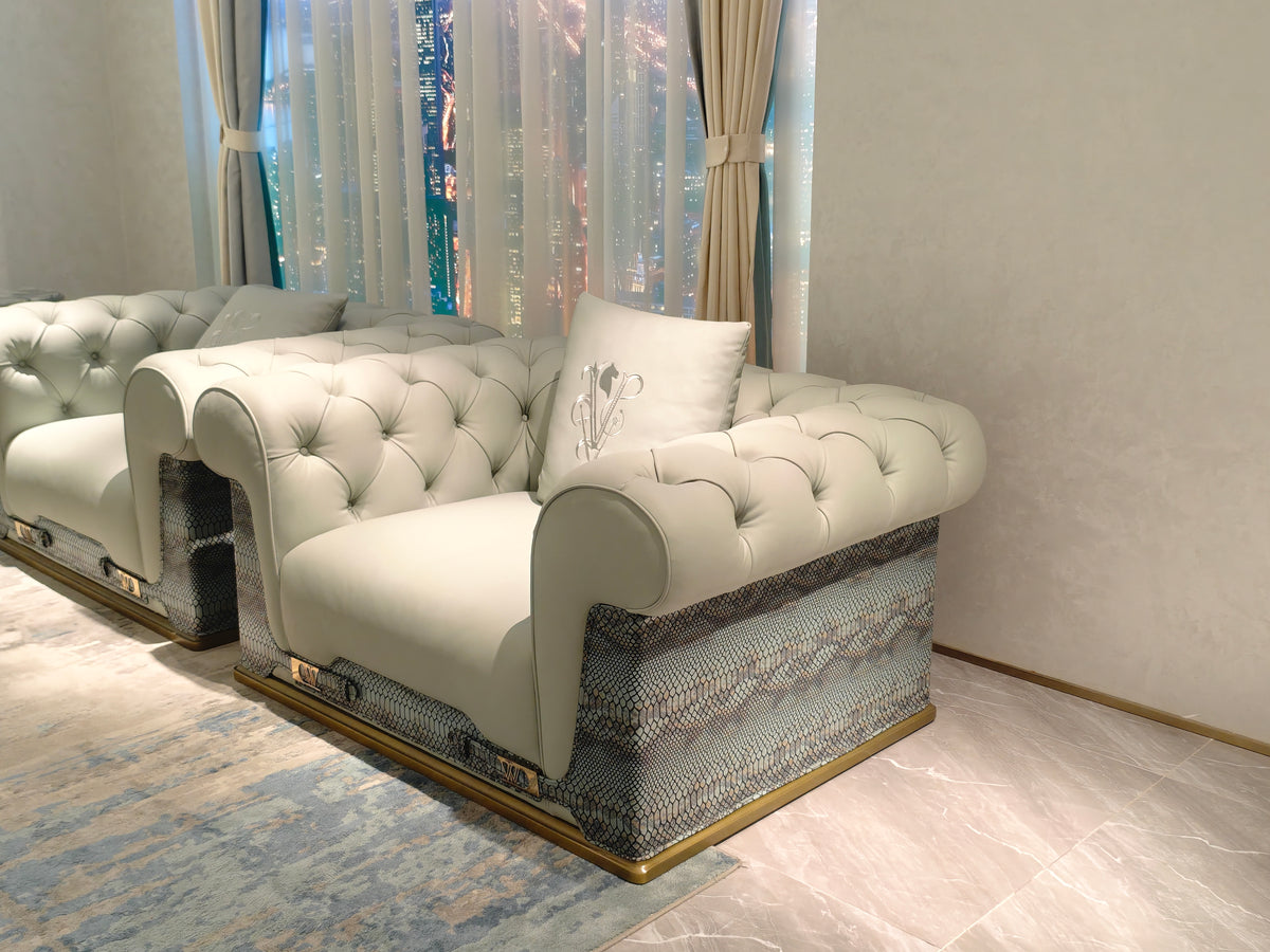 Luxury Tufted Sofa with Embroidered Pillows and Patterned Accents