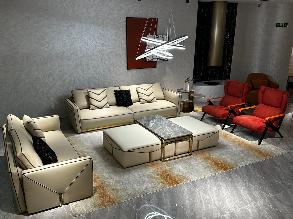 Luxury Cream Leather Sofa with Decorative Pillows and Gold Accents