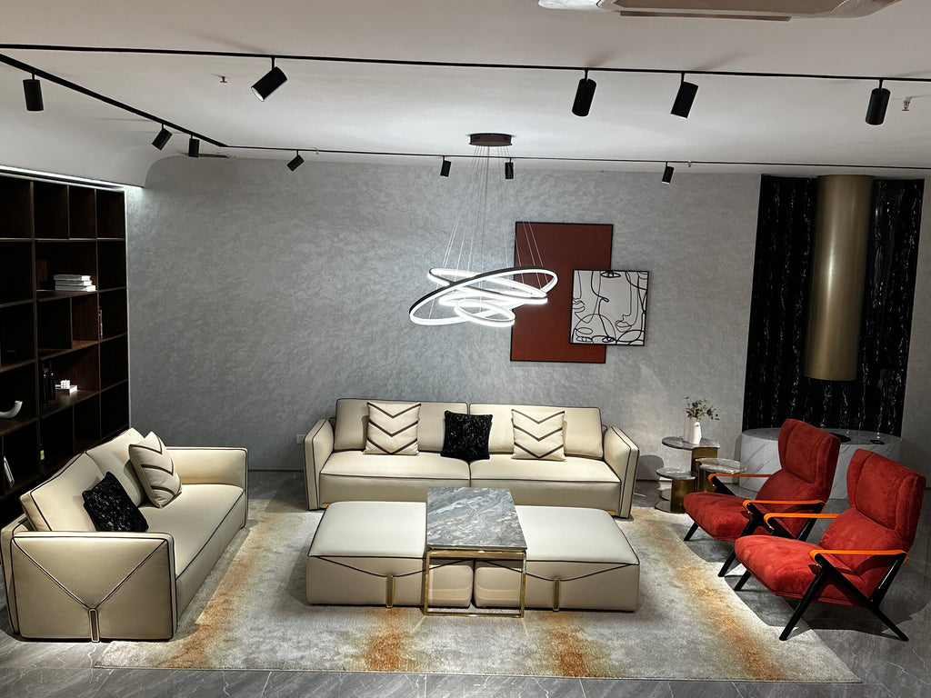 Luxury Cream Leather Sofa with Decorative Pillows and Gold Accents