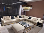 Luxury Cream Leather Sofa with Decorative Pillows and Gold Accents
