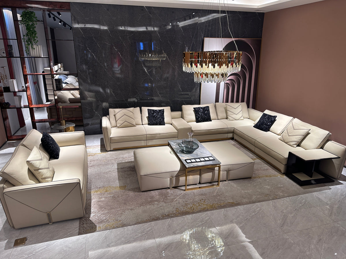 Luxury Cream Leather Sofa with Decorative Pillows and Gold Accents