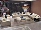 Luxury Cream Leather Sofa with Decorative Pillows and Gold Accents
